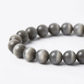 Grey cat's eye stone bracelet macro chatoyant shimmer